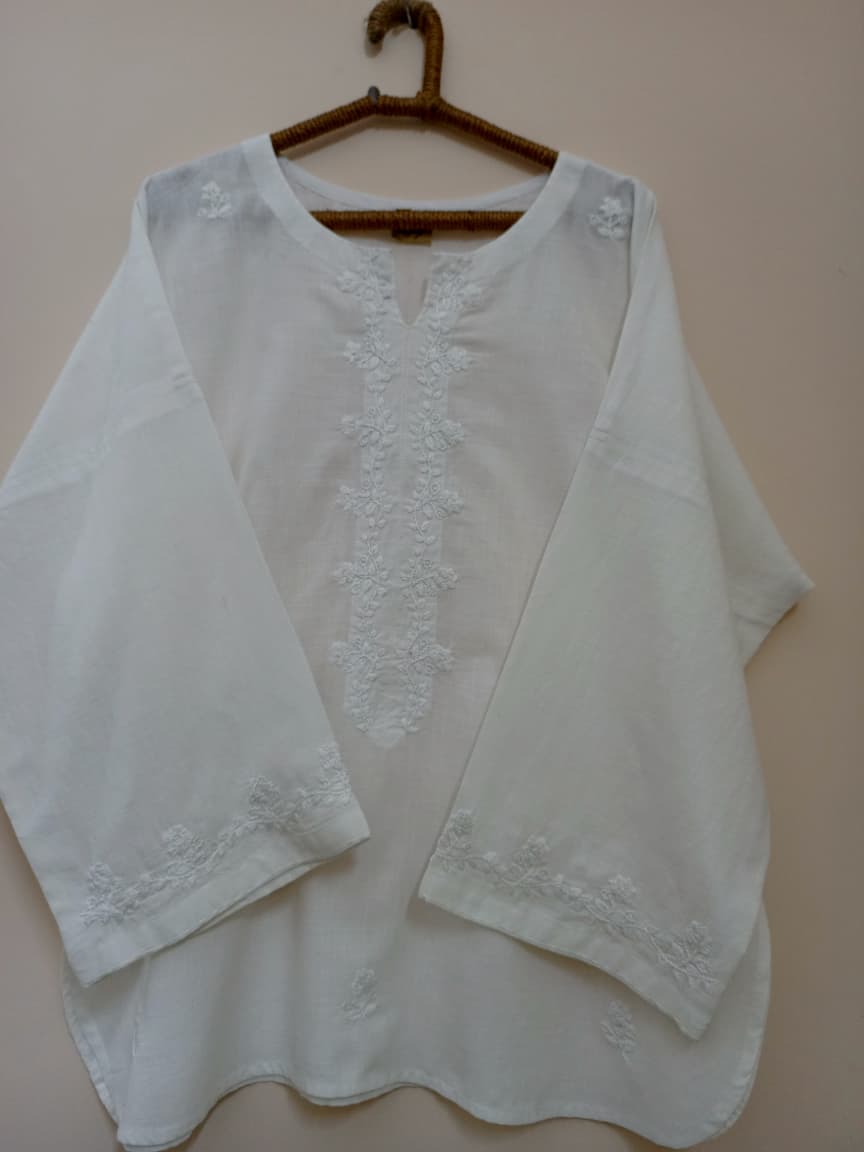 Graceful white kurti with delicate hand embroidery. A timeless piece perfect for everyday elegance.